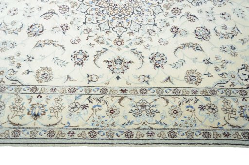 Corner detail of 2000s Nain rug showing border pattern and Wool pile