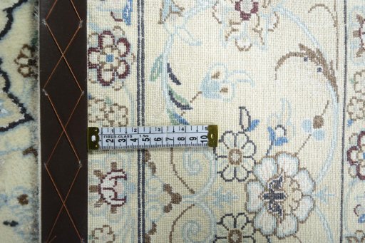 Backside of handmade 2000s Nain rug showing knot structure and weave density