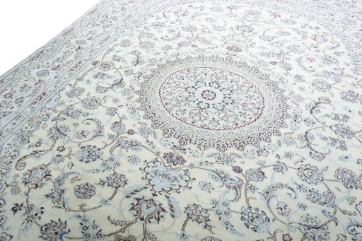 Backside of handmade New Nain rug showing knot structure and weave density
