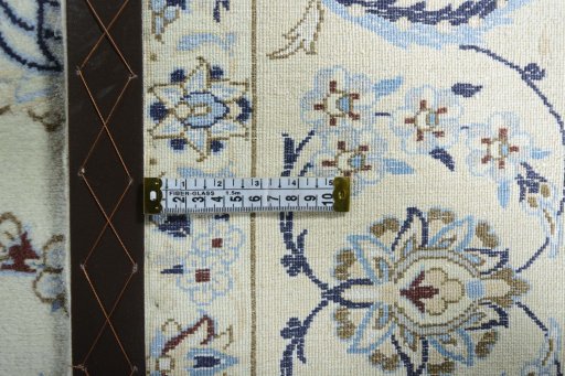 Backside of handmade 2000s Nain rug showing knot structure and weave density