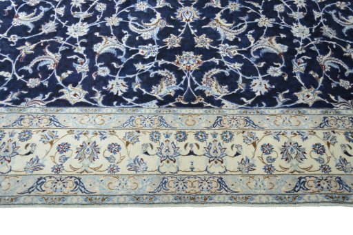 Corner detail of 2000s Nain rug showing border pattern and Wool pile