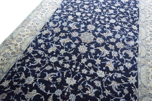 Backside of handmade 2000s Nain rug showing knot structure and weave density