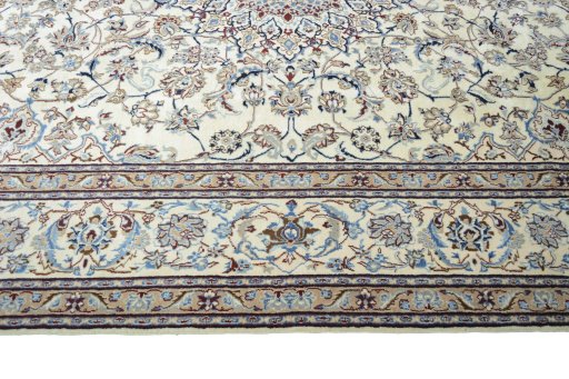 Corner detail of 2000s Nain rug showing border pattern and Wool pile