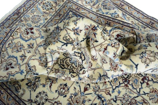 Surface texture of 2000s Nain rug with natural Wool and intricate pattern