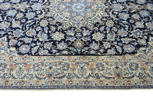 Corner detail of 1970s Nain rug showing border pattern and Cork pile