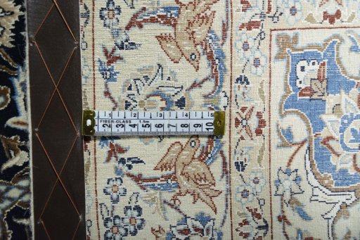Backside of handmade 1970s Nain rug showing knot structure and weave density