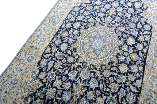 Backside of handmade 1970s Nain rug showing knot structure and weave density