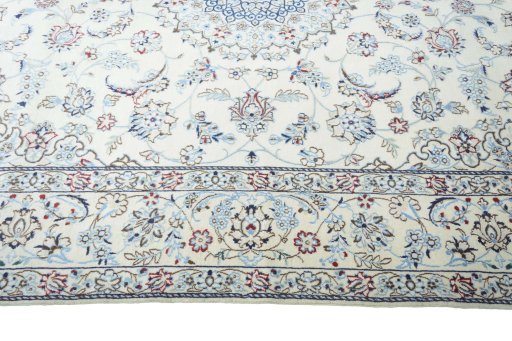 Corner detail of 2000s Nain rug showing border pattern and Wool pile