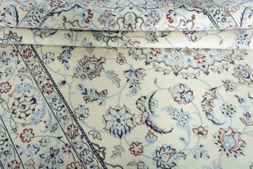 Close-up detail of 2000s Nain rug from Iran / Persia showing Wool weave