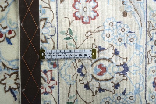 Backside of handmade 2000s Nain rug showing knot structure and weave density