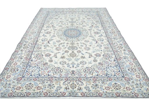 Surface texture of 2000s Nain rug with natural Wool and intricate pattern