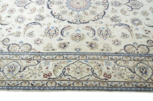 Corner detail of 2000s Nain rug showing border pattern and Wool pile