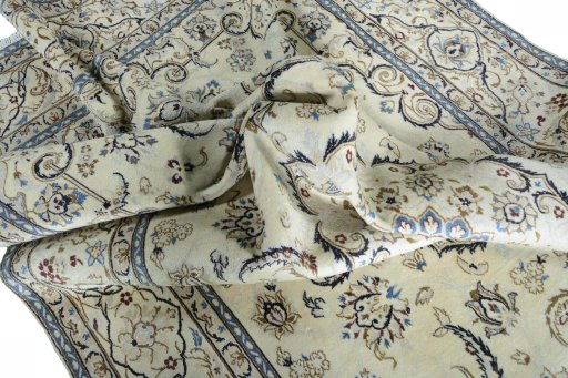 Surface texture of 2000s Nain rug with natural Wool and intricate pattern