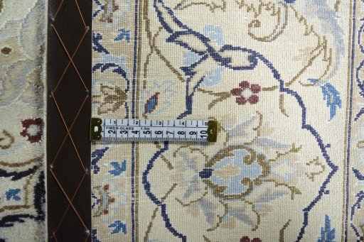 Backside of handmade 2000s Nain rug showing knot structure and weave density