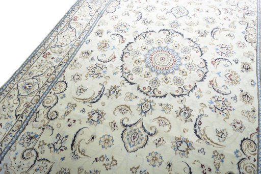 Backside of handmade 2000s Nain rug showing knot structure and weave density