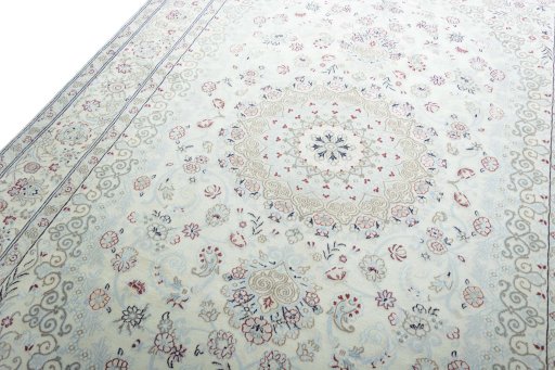 Backside of handmade New Nain rug showing knot structure and weave density