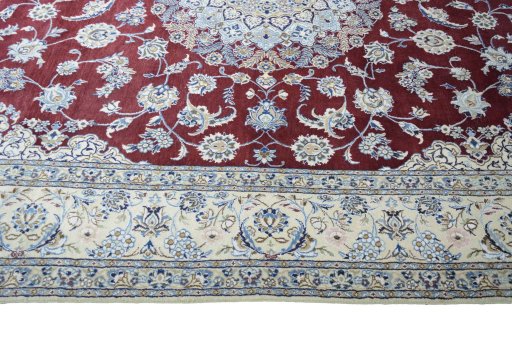 Corner detail of 2000s Nain rug showing border pattern and Wool pile