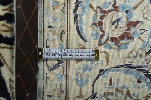 Backside of handmade New Nain rug showing knot structure and weave density