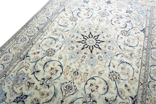 Backside of handmade New Nain rug showing knot structure and weave density