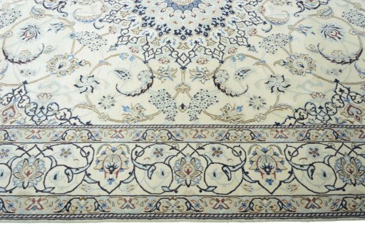 Corner detail of 2000s Nain rug showing border pattern and Wool pile