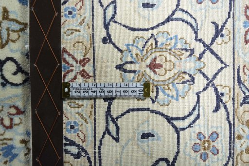 Backside of handmade 2000s Nain rug showing knot structure and weave density