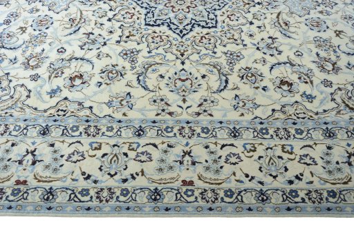 Corner detail of 2000s Nain rug showing border pattern and Wool pile