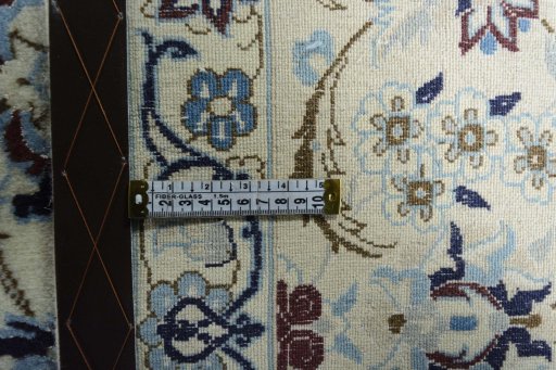 Backside of handmade 2000s Nain rug showing knot structure and weave density