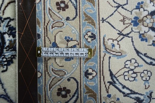 Backside of handmade New Nain rug showing knot structure and weave density