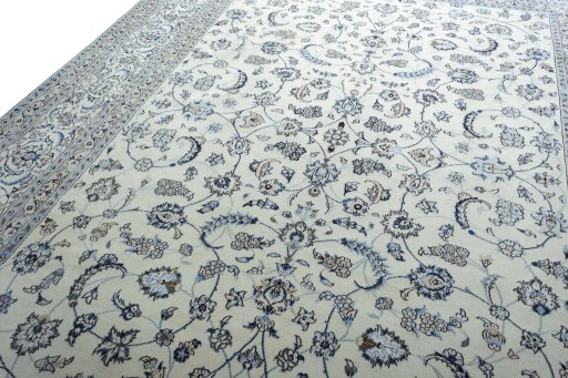 Backside of handmade New Nain rug showing knot structure and weave density