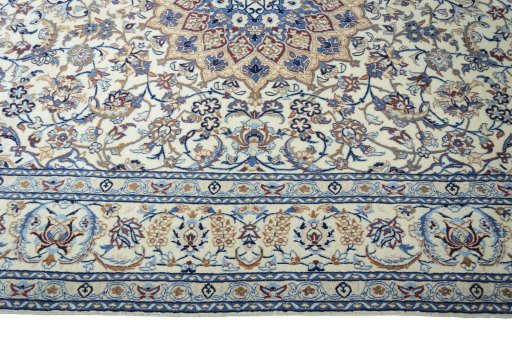 Corner detail of 2000s Nain rug showing border pattern and Wool pile