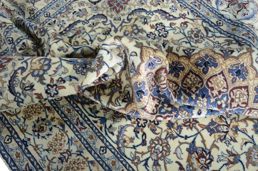 Surface texture of 2000s Nain rug with natural Wool and intricate pattern