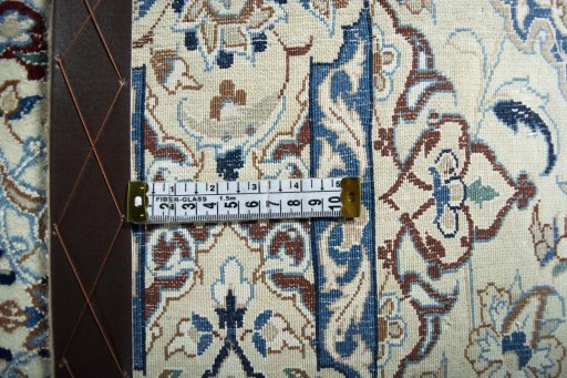 Surface texture of 2000s Nain rug with natural Wool and intricate pattern