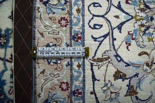 Backside of handmade 2000s Nain rug showing knot structure and weave density
