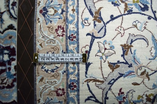 Backside of handmade 2000s Nain rug showing knot structure and weave density