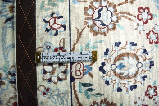 Backside of handmade 2000s Nain rug showing knot structure and weave density