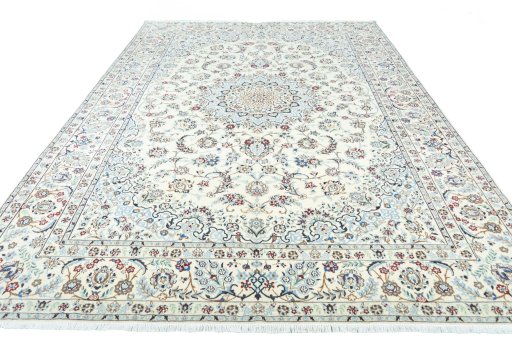 Surface texture of 2000s Nain rug with natural Wool and intricate pattern
