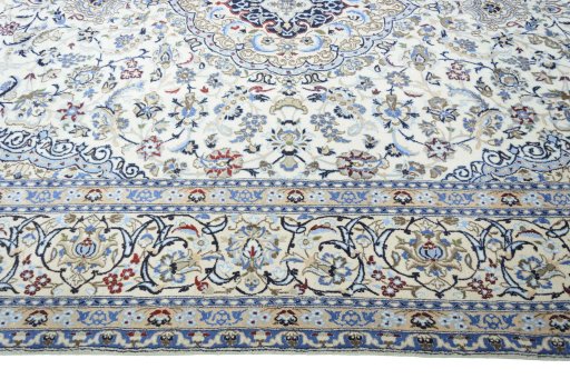 Corner detail of 2000s Nain rug showing border pattern and Wool pile