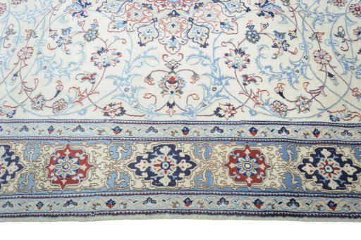 Corner detail of 2000s Nain rug showing border pattern and Wool pile