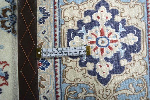 Backside of handmade 2000s Nain rug showing knot structure and weave density