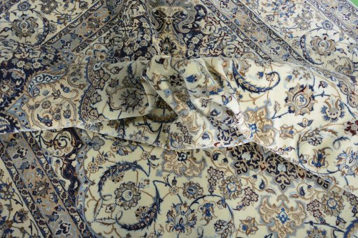 Surface texture of 2000s Nain rug with natural Cork and intricate pattern