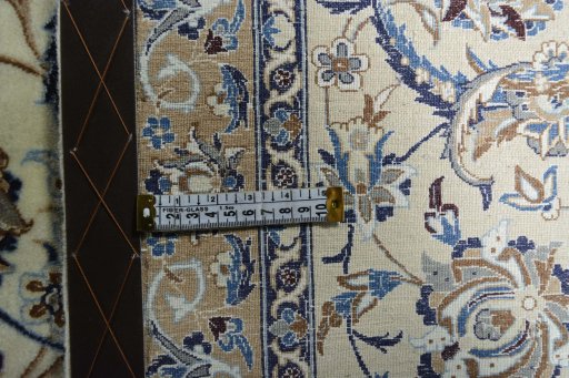 Backside of handmade 2000s Nain rug showing knot structure and weave density
