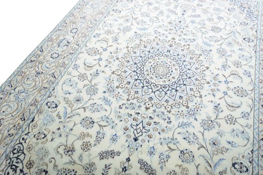 Backside of handmade New Nain rug showing knot structure and weave density