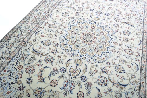 Backside of handmade New Nain rug showing knot structure and weave density