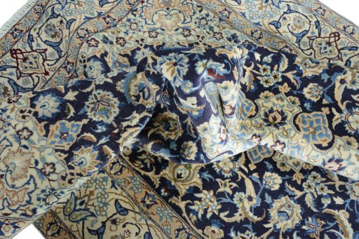Surface texture of 2000s Nain rug with natural Wool and intricate pattern