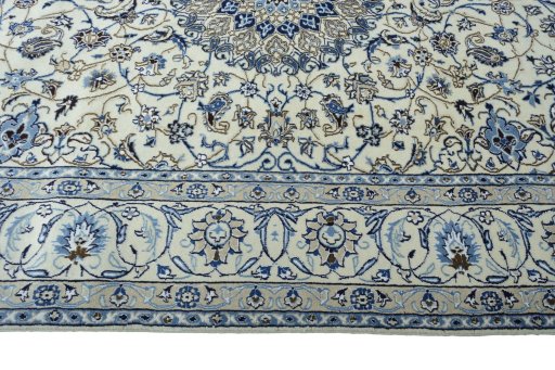 Corner detail of 2000s Nain rug showing border pattern and Wool pile