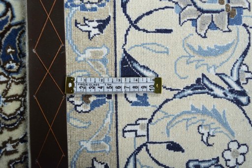 Backside of handmade 2000s Nain rug showing knot structure and weave density