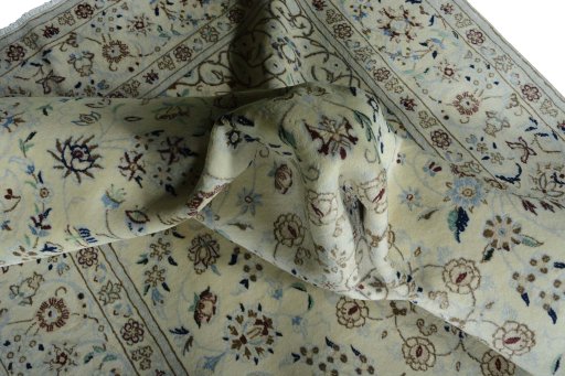 Surface texture of 2000s Nain rug with natural Wool and intricate pattern