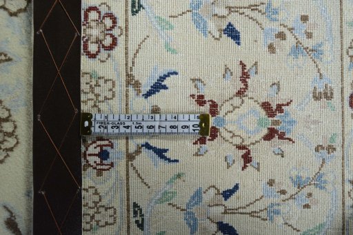 Backside of handmade 2000s Nain rug showing knot structure and weave density