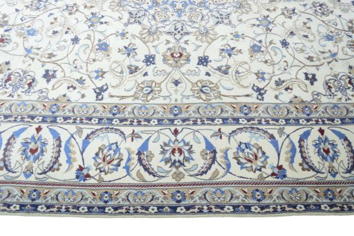 Corner detail of 2000s Nain rug showing border pattern and Wool pile