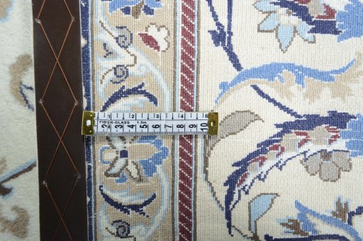 Backside of handmade 2000s Nain rug showing knot structure and weave density